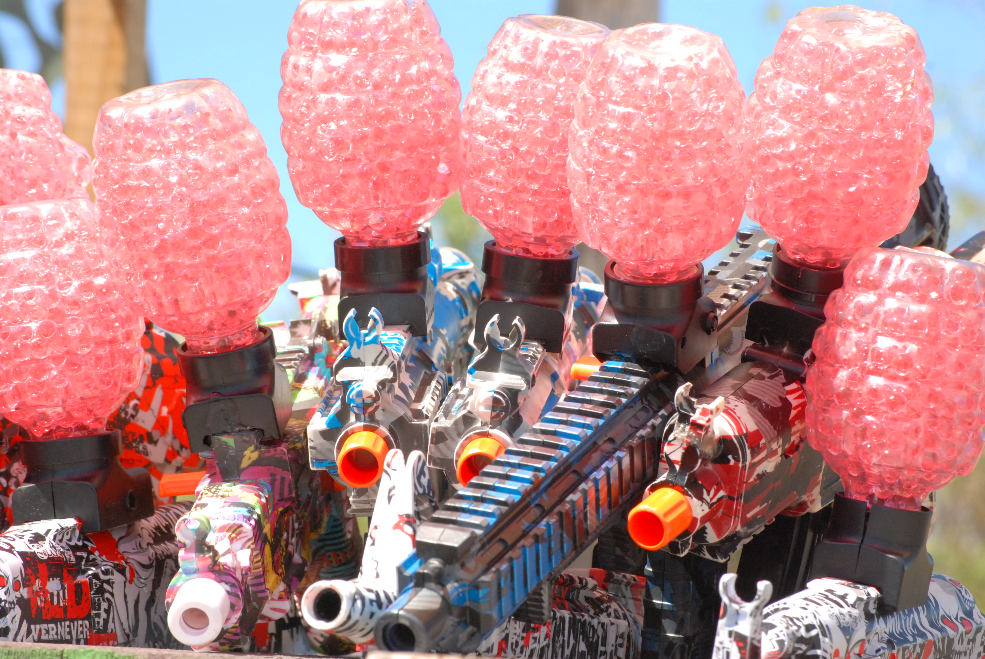 Dead Eye Airsoft gel blasters loaded with pink gel balls