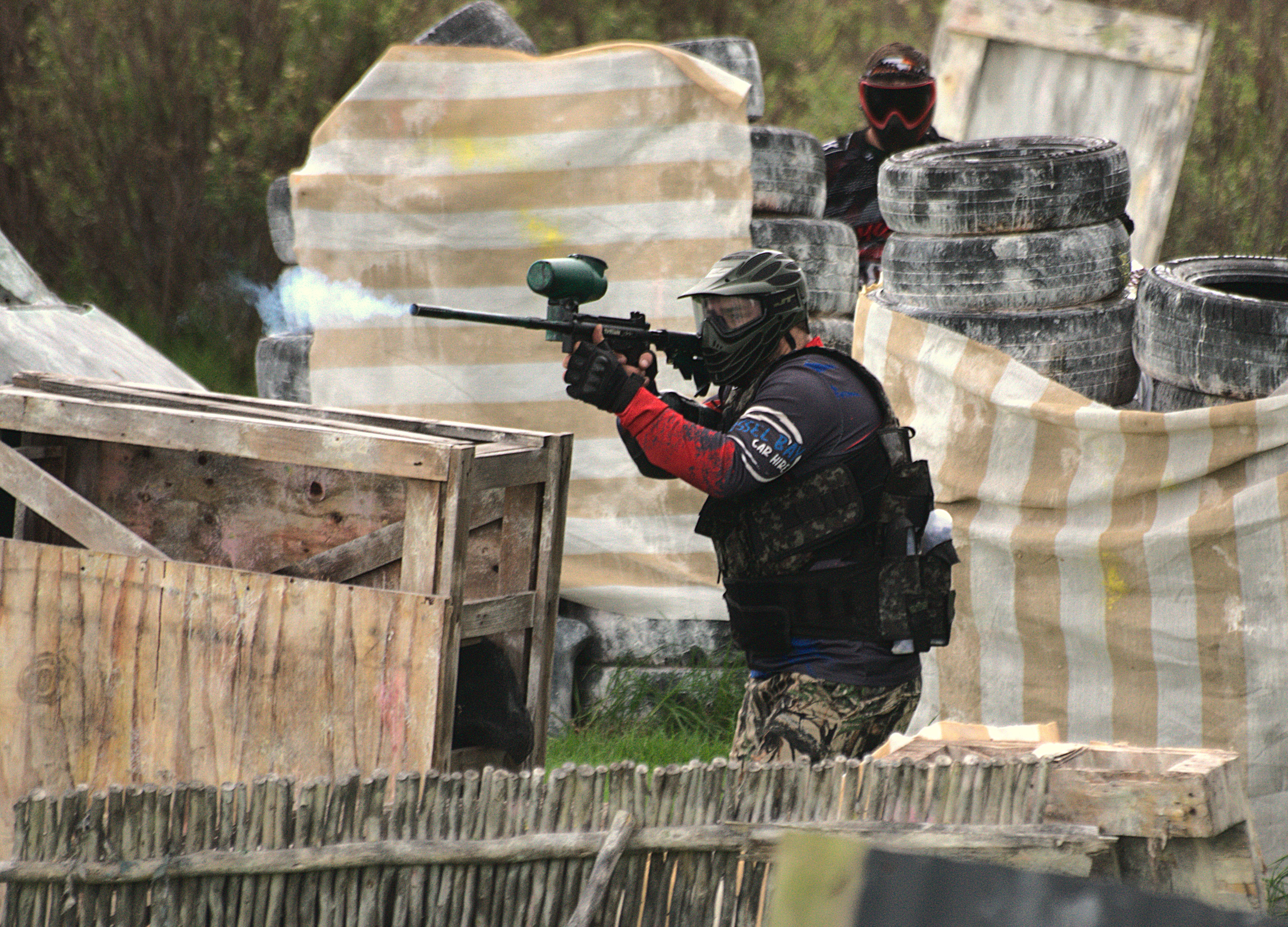 Dead Eye Airsoft paintball player firing from cover